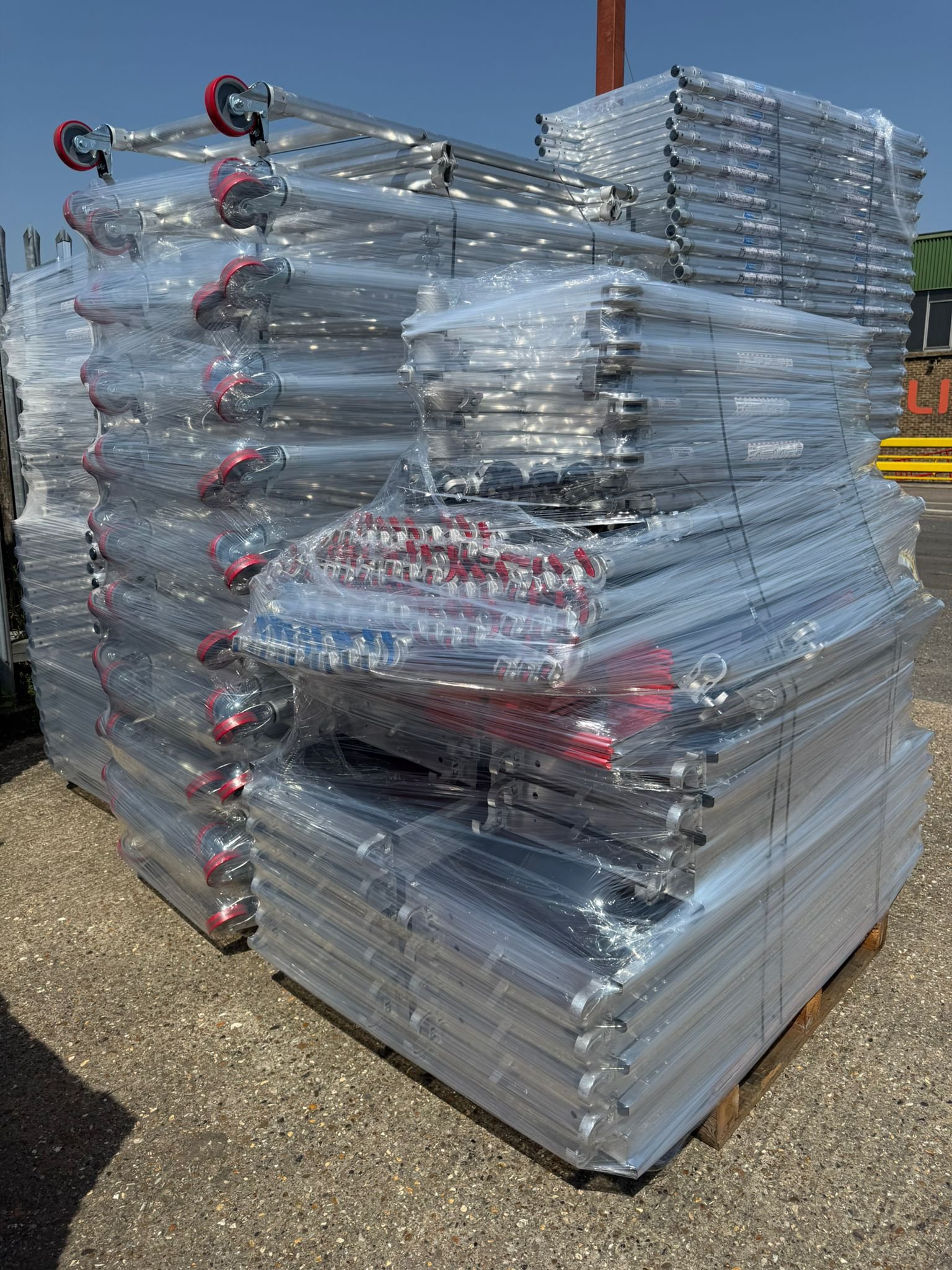 Aluminium scaffold towers stacked on pallets and ready for dispatch from our warehouse across the UK.