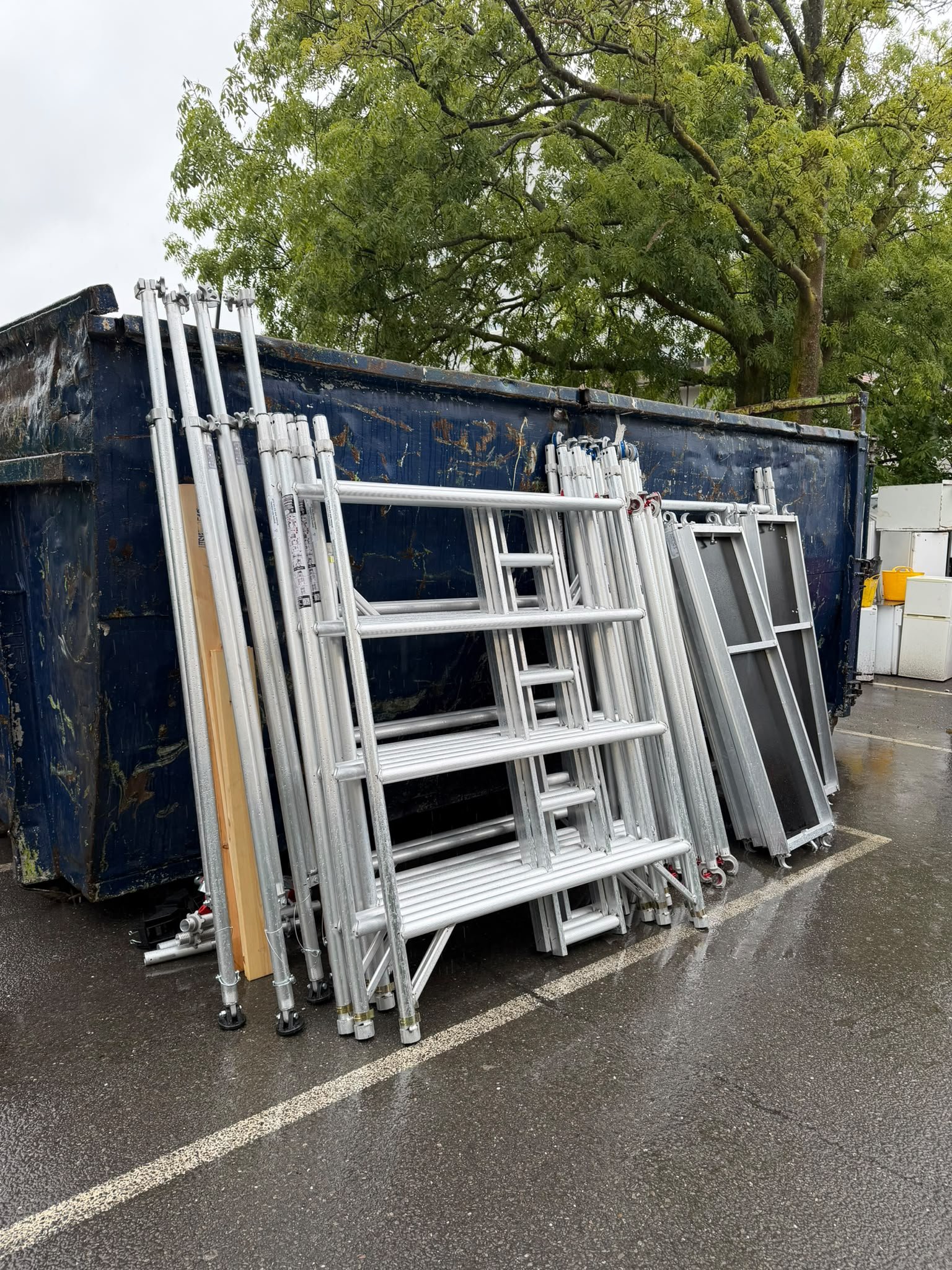 Aluminium scaffold tower components, frames, braces and platforms stacked and ready for delivery.